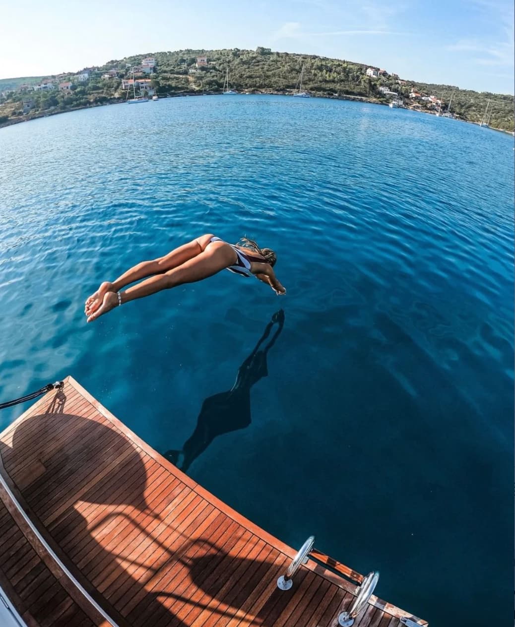 Secluded pebble beach surrounded by pine forests on a Croatian island