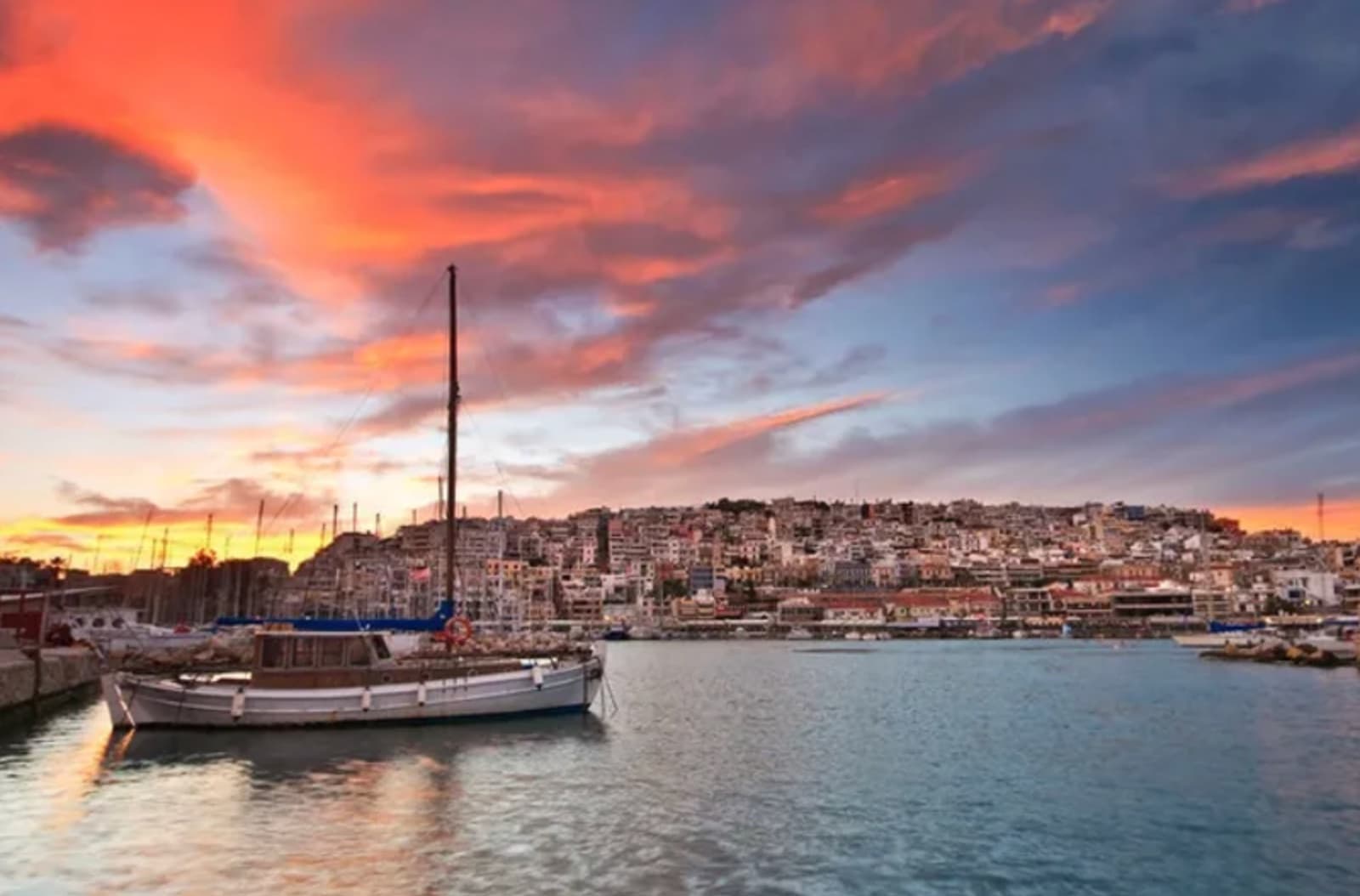 Traditional Greek taverna by the harbor with fresh seafood on the table