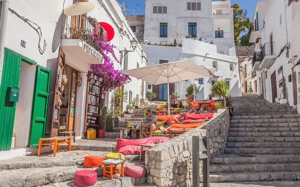 Aerial view of a yacht anchored in a pristine Ibiza cove