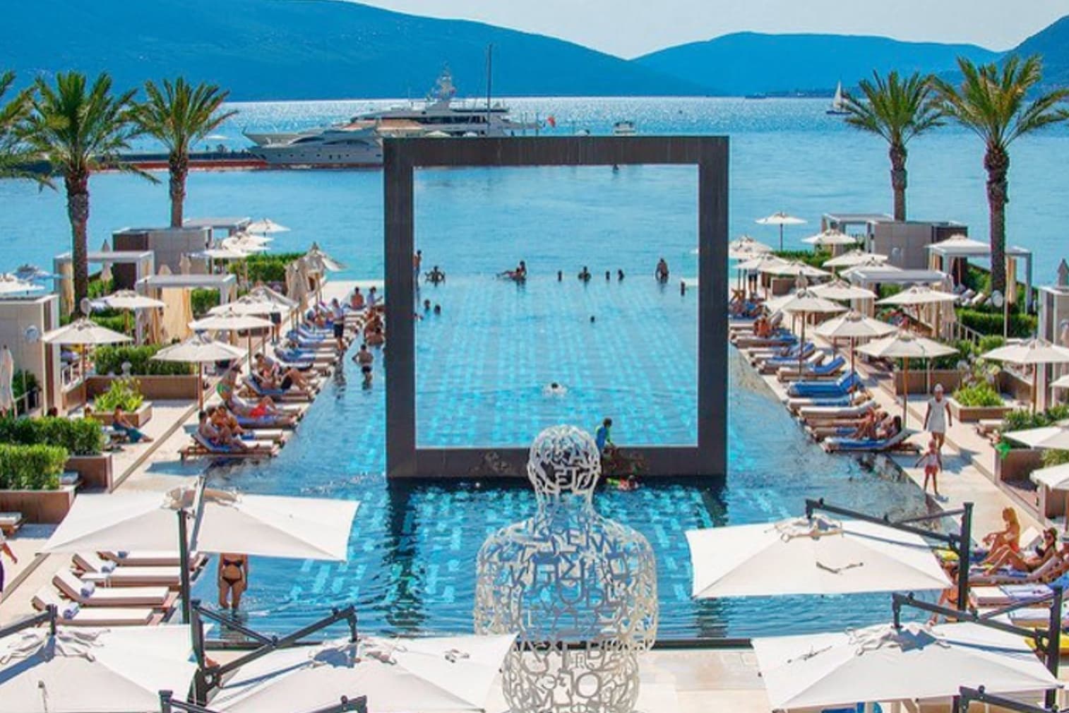 Swimming in crystal-clear Adriatic waters near a Montenegrin beach