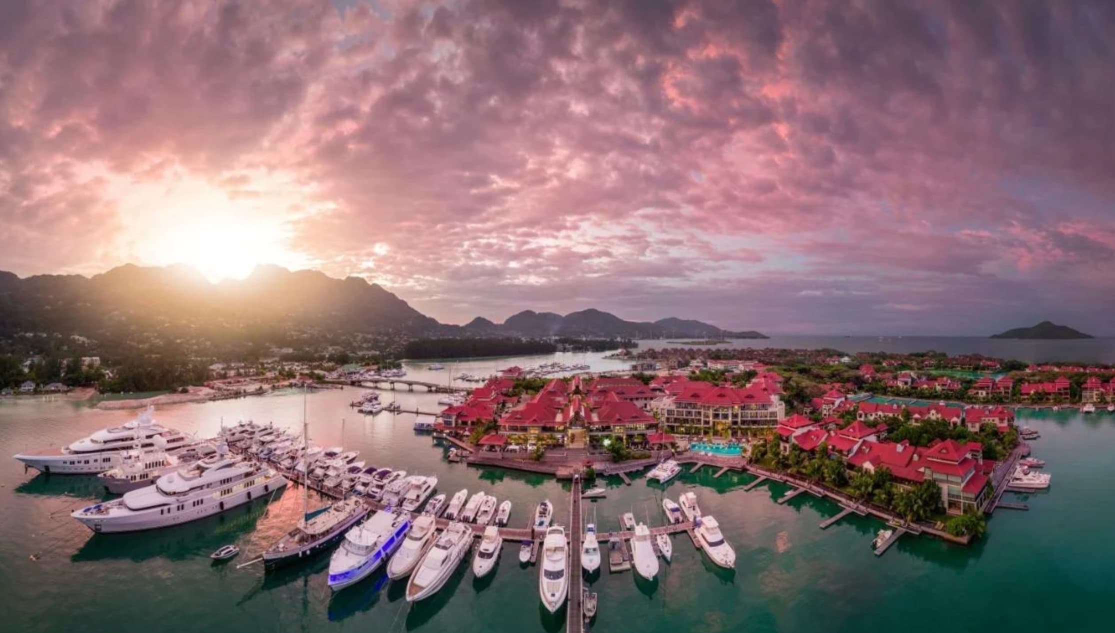 Aerial view of a catamaran sailing between Seychelles islands