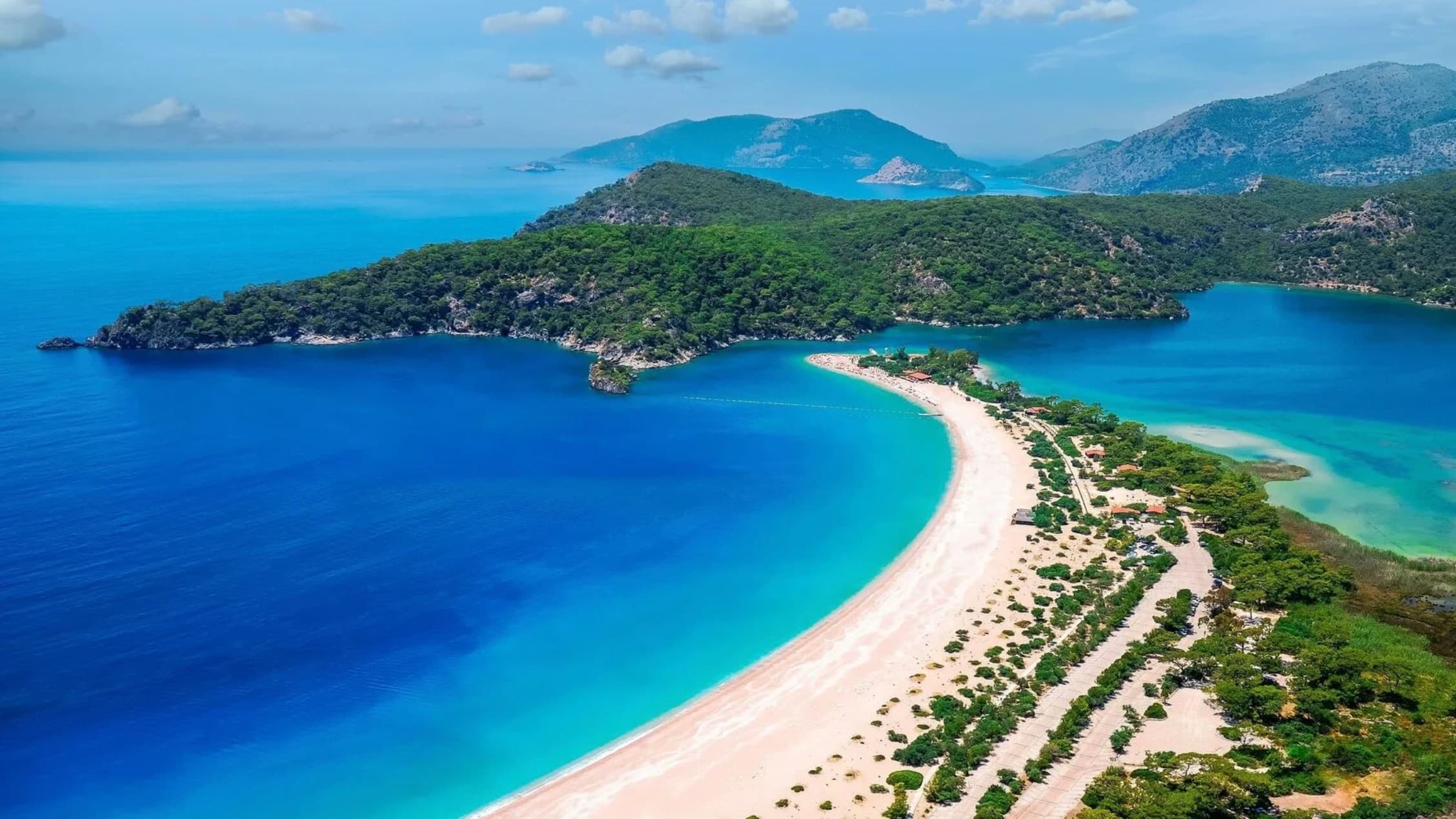 Turquoise waters of the Twelve Islands near Gocek surrounded by pine forests